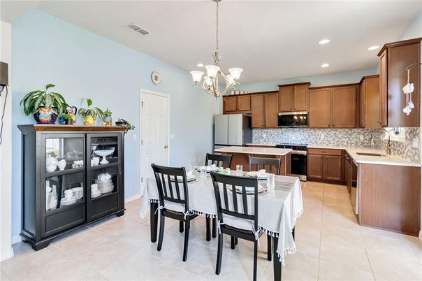 Chandelier, Dining room, Interior, Kitchen, Pendant Lights, Recessed Lighting, Stainless Steel Appliances