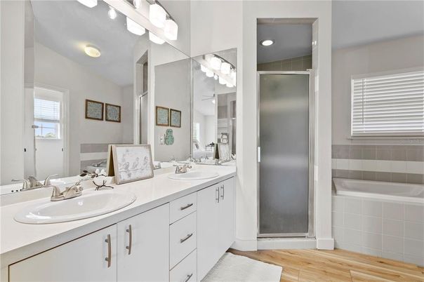 Bathroom, Dual Sink Vanities, Interior, Recessed Lighting, Wood Texture Flooring
