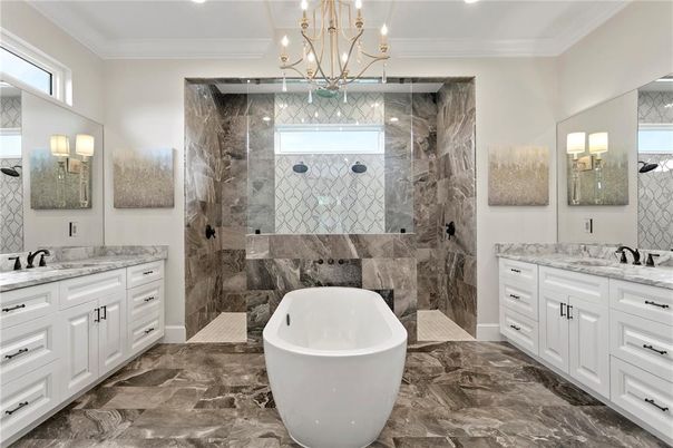 Bathroom, Chandelier, Dual Sink Vanities, Free Standing Baths, Glass Shower, Interior, Marble, Marble Walls, Recessed Lighting