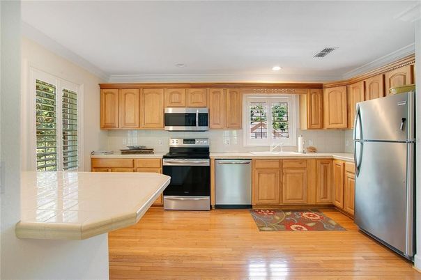 Interior, Kitchen, Recessed Lighting, Stainless Steel Appliances, Wood Texture Flooring