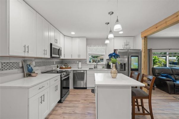 Interior, Kitchen, Pendant Lights, Recessed Lighting, Stainless Steel Appliances, Wood Texture Flooring
