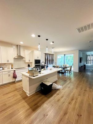 Dining room, Interior, Kitchen, Pendant Lights, Recessed Lighting, Stainless Steel Appliances, Wood Texture Flooring