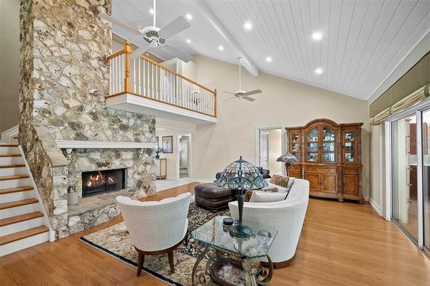 Fireplace, Interior, Living room, Recessed Lighting, Stone Walls, Wood Texture Flooring
