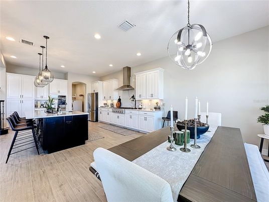 Dining room, Interior, Kitchen, Pendant Lights, Recessed Lighting, Stainless Steel Appliances, Wood Texture Flooring