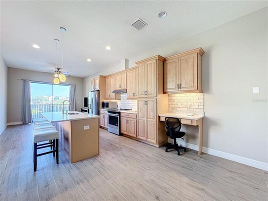 Dining room, Interior, Kitchen, Pendant Lights, Recessed Lighting, Stainless Steel Appliances, Wood Texture Flooring