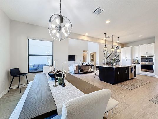 Dining room, Interior, Kitchen, Living room, Pendant Lights, Recessed Lighting, Stainless Steel Appliances, Wood Texture Flooring