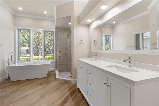 Bathroom, Dual Sink Vanities, Free Standing Baths, Glass Shower, Interior, Recessed Lighting, Wood Texture Flooring