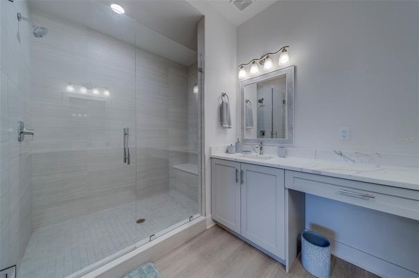Bathroom, Dual Sink Vanities, Glass Shower, Interior, Recessed Lighting, Wood Texture Flooring