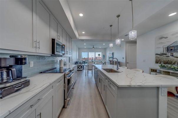 Dining room, Interior, Kitchen, Pendant Lights, Recessed Lighting, Stainless Steel Appliances, Wood Texture Flooring