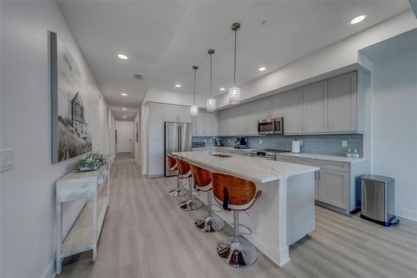 Interior, Kitchen, Pendant Lights, Recessed Lighting, Stainless Steel Appliances, Wood Texture Flooring