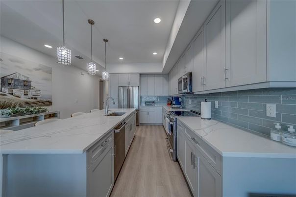 Interior, Kitchen, Pendant Lights, Recessed Lighting, Stainless Steel Appliances, Wood Texture Flooring