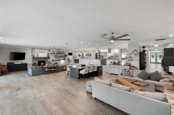 Dining room, Fireplace, Interior, Kitchen, Living room, Pendant Lights, Recessed Lighting, Stainless Steel Appliances, Wood Texture Flooring