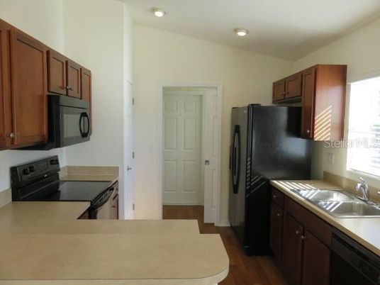 Interior, Kitchen, Recessed Lighting, Tile Countertops, Wood Texture Flooring