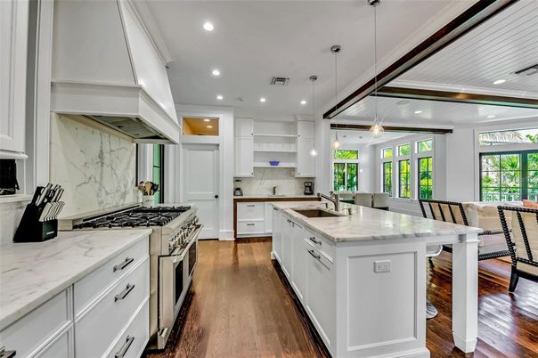 Interior, Kitchen, Marble Walls, Pendant Lights, Recessed Lighting, Stainless Steel Appliances, Wood Texture Flooring
