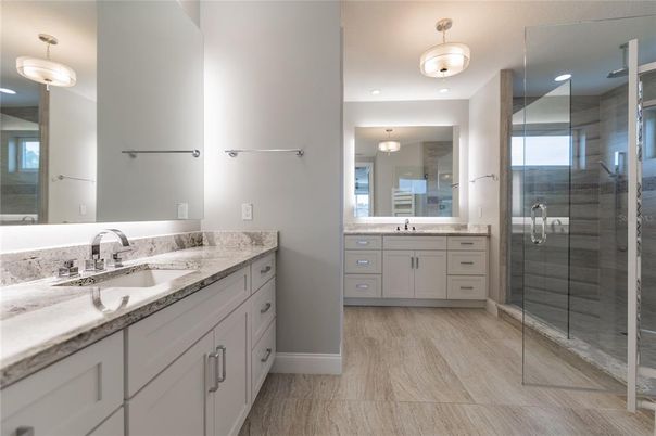 Bathroom, Dual Sink Vanities, Glass Shower, Interior, Pendant Lights, Wood Texture Flooring