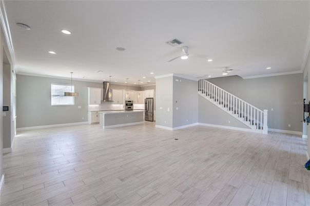 Empty room, Interior, Kitchen, Pendant Lights, Recessed Lighting, Stainless Steel Appliances, Wood Texture Flooring