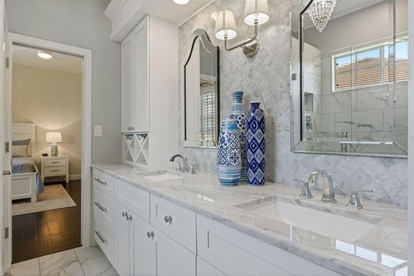 Bathroom, Dual Sink Vanities, Interior, Marble, Marble Walls, Recessed Lighting, Wood Texture Flooring