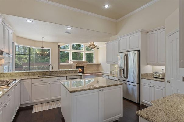 Chandelier, Fireplace, Interior, Kitchen, Pendant Lights, Recessed Lighting, Wood Texture Flooring