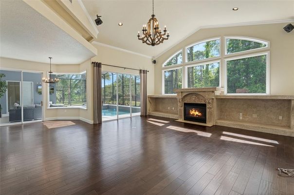 Chandelier, Empty room, Fireplace, Interior, Recessed Lighting, Wood Texture Flooring