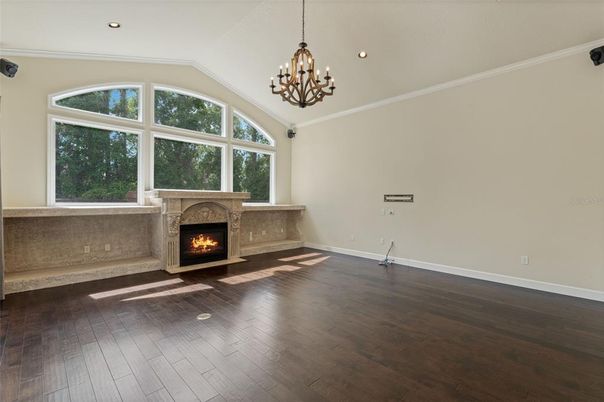 Chandelier, Empty room, Fireplace, Interior, Recessed Lighting, Wood Texture Flooring