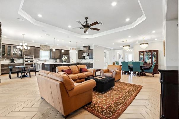 Chandelier, Dining room, Interior, Kitchen, Living room, Pendant Lights, Recessed Lighting, Stainless Steel Appliances, Wood Texture Flooring