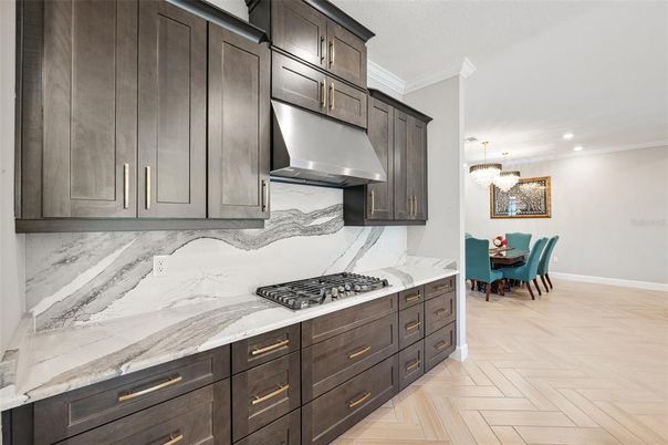 Chandelier, Dining room, Interior, Kitchen, Marble Walls, Recessed Lighting, Wood Texture Flooring