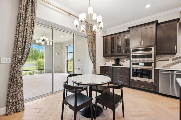 Chandelier, Dining room, Interior, Kitchen, Recessed Lighting, Stainless Steel Appliances, Wood Texture Flooring
