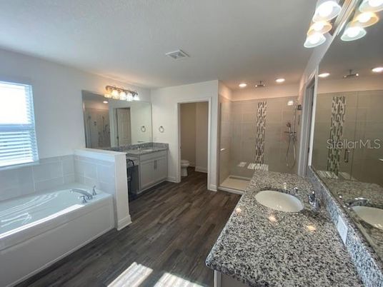 Bathroom, Dual Sink Vanities, Glass Shower, Interior, Recessed Lighting, Wood Texture Flooring