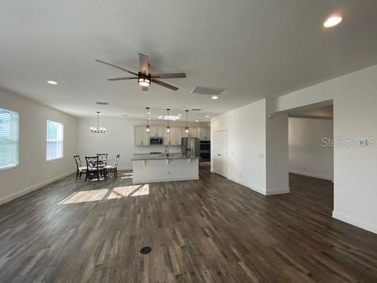 Chandelier, Dining room, Interior, Kitchen, Pendant Lights, Recessed Lighting, Stainless Steel Appliances, Wood Texture Flooring
