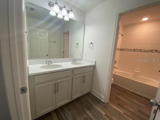 Bathroom, Dual Sink Vanities, Interior, Recessed Lighting, Wood Texture Flooring