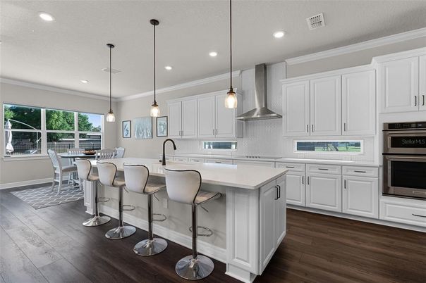 Dining room, Interior, Kitchen, Pendant Lights, Recessed Lighting, Stainless Steel Appliances, Wood Texture Flooring