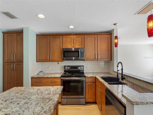 Interior, Kitchen, Pendant Lights, Recessed Lighting, Stainless Steel Appliances, Wood Texture Flooring