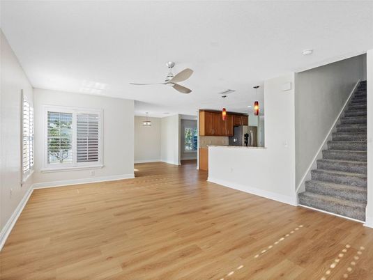 Empty room, Interior, Kitchen, Pendant Lights, Stainless Steel Appliances, Wood Texture Flooring
