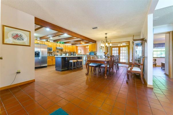 Chandelier, Dining room, Interior, Kitchen, Pendant Lights, Stainless Steel Appliances, Wooden Beams