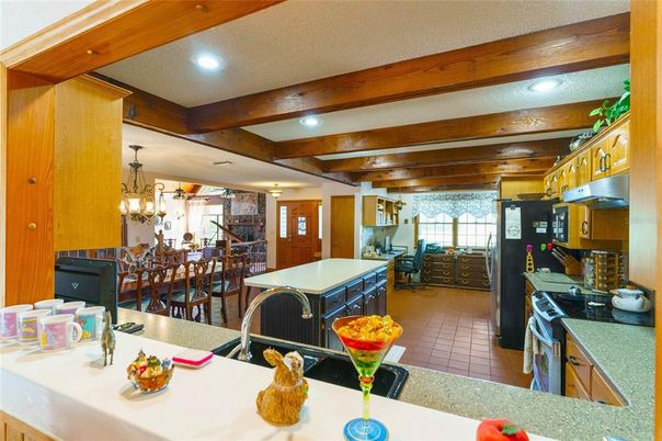 Chandelier, Dining room, Interior, Kitchen, Recessed Lighting, Stainless Steel Appliances, Wooden Beams