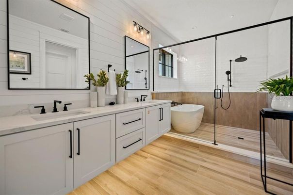 Bathroom, Dual Sink Vanities, Free Standing Baths, Glass Shower, Interior, Wood Texture Flooring