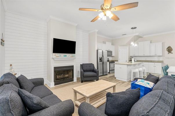 Fireplace, Interior, Kitchen, Living room, Pendant Lights, Stainless Steel Appliances, Wood Texture Flooring
