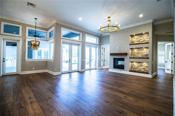 Chandelier, Empty room, Fireplace, Interior, Pendant Lights, Recessed Lighting, Wood Texture Flooring