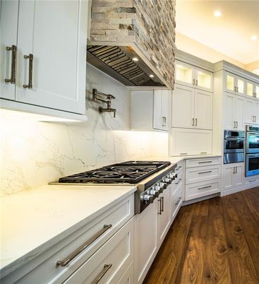 Interior, Kitchen, Marble Walls, Recessed Lighting, Stainless Steel Appliances, Wood Texture Flooring