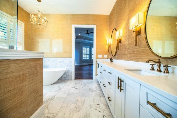 Bathroom, Chandelier, Dual Sink Vanities, Free Standing Baths, Interior, Marble, Pendant Lights