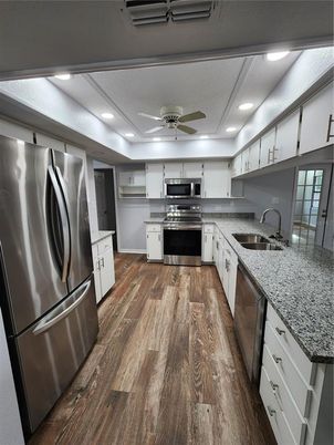 Interior, Kitchen, Recessed Lighting, Stainless Steel Appliances, Wood Texture Flooring
