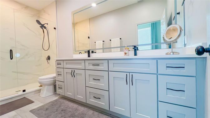 Bathroom, Dual Sink Vanities, Glass Shower, Interior, Marble Walls, Recessed Lighting