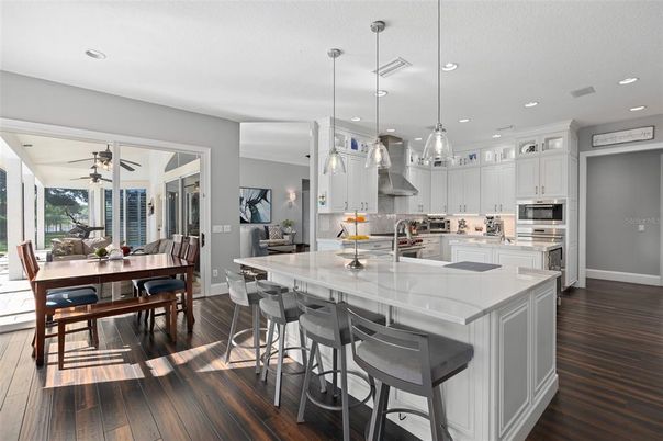 Dining room, Interior, Kitchen, Pendant Lights, Recessed Lighting, Stainless Steel Appliances, Wood Texture Flooring