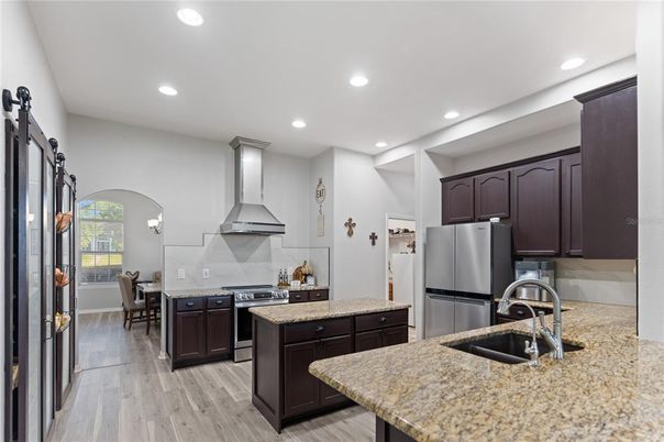 Dining room, Interior, Kitchen, Recessed Lighting, Stainless Steel Appliances, Wood Texture Flooring