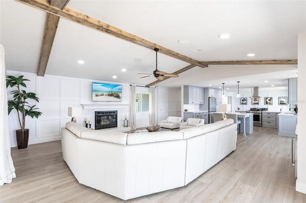 Fireplace, Interior, Kitchen, Living room, Pendant Lights, Recessed Lighting, Stainless Steel Appliances, Wooden Beams, Wood Texture Flooring