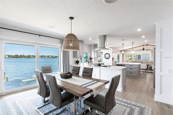 Dining room, Interior, Kitchen, Pendant Lights, Recessed Lighting, Stainless Steel Appliances, Water, Wood Texture Flooring