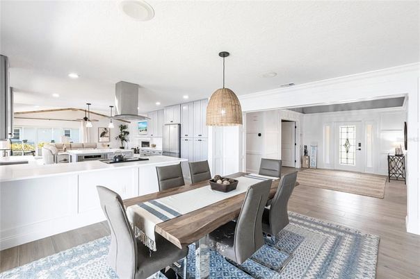 Dining room, Interior, Kitchen, Pendant Lights, Recessed Lighting, Stainless Steel Appliances, Wood Texture Flooring