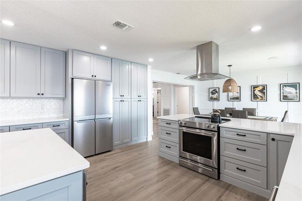 Dining room, Interior, Kitchen, Pendant Lights, Recessed Lighting, Stainless Steel Appliances, Wood Texture Flooring