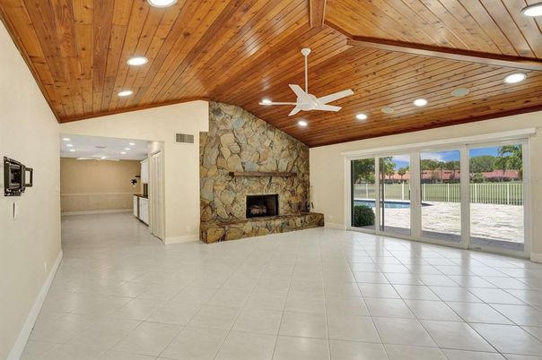 Empty room, Fireplace, Interior, Recessed Lighting, Stone Walls, Wooden Ceilings
