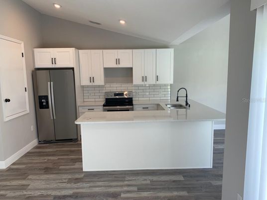 Interior, Kitchen, Recessed Lighting, Stainless Steel Appliances, Wood Texture Flooring